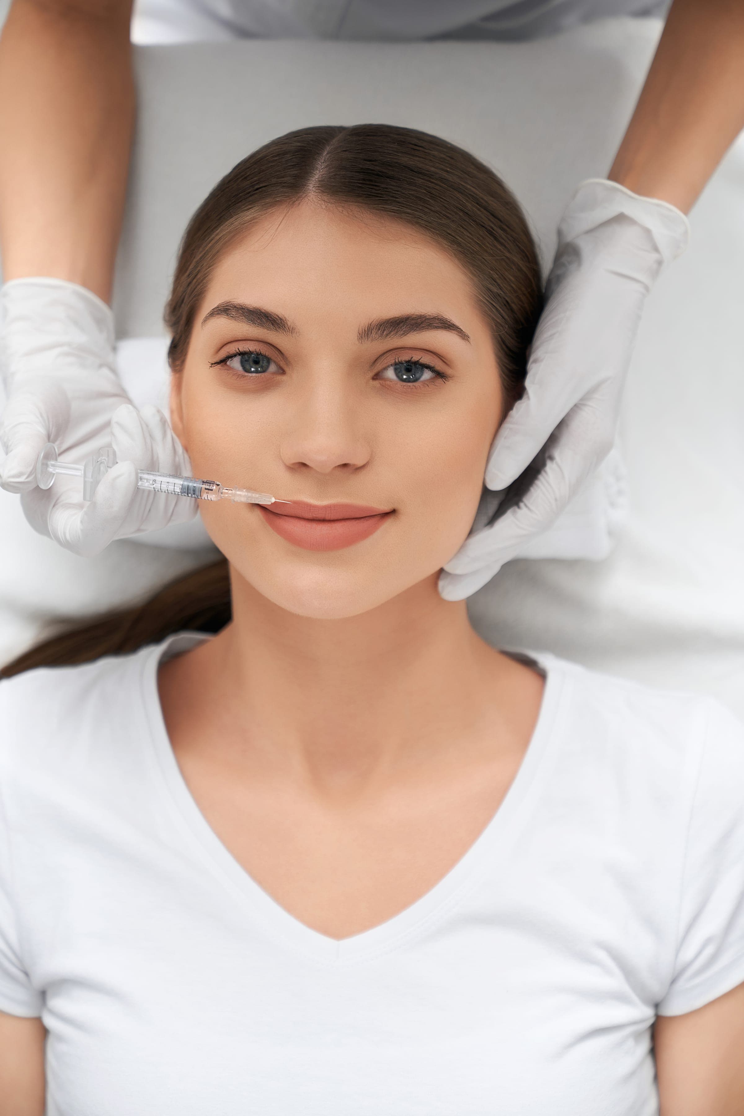 Provider performing a lip filler treatment